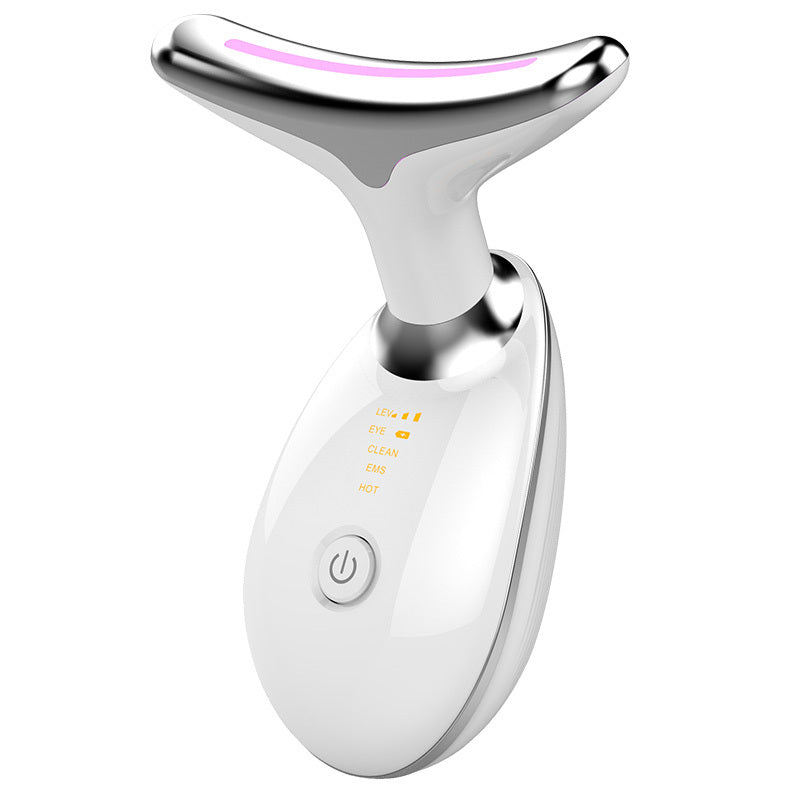 White and silver facial massager on a white background