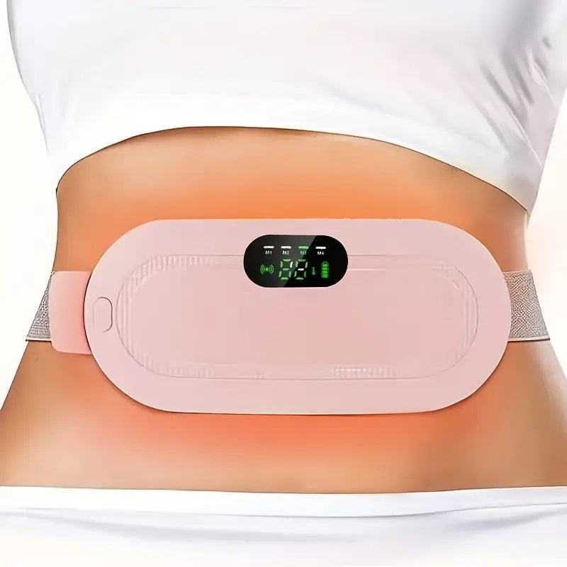 Electronic heating belt on a person's waist with a digital display.