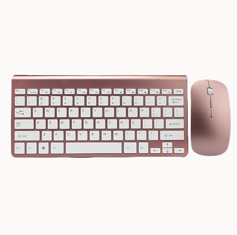 Rose gold keyboard and mouse set on a white background