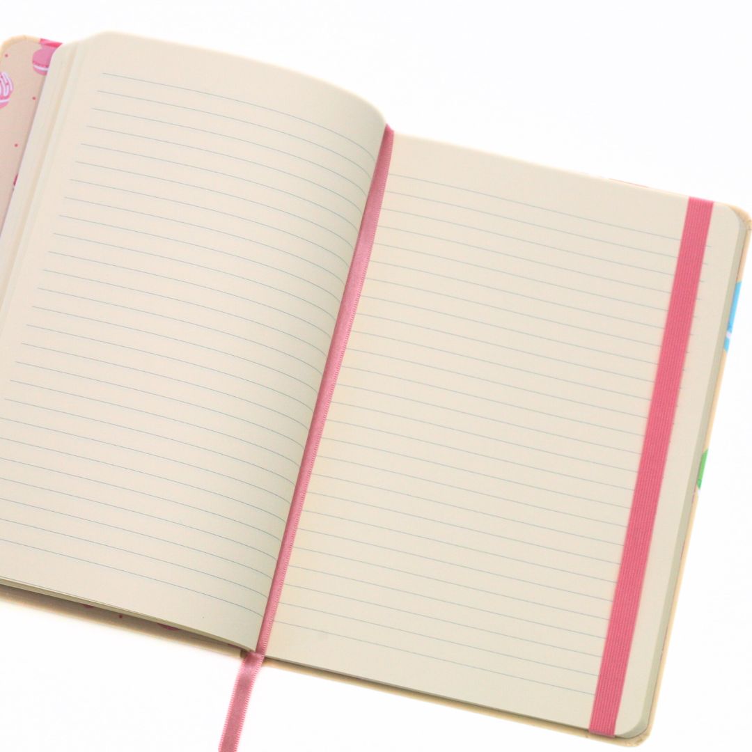 Open notebook with pink binding on a white background