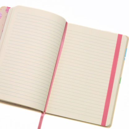 Open notebook with pink binding on a white background